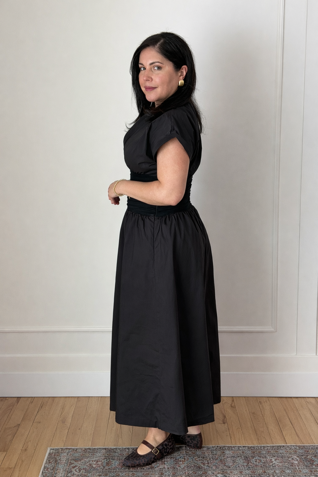 black midi dress with v-necklines and cinched waist.
