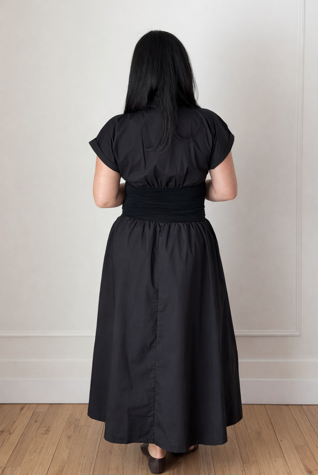 black midi dress with v-necklines and cinched waist.