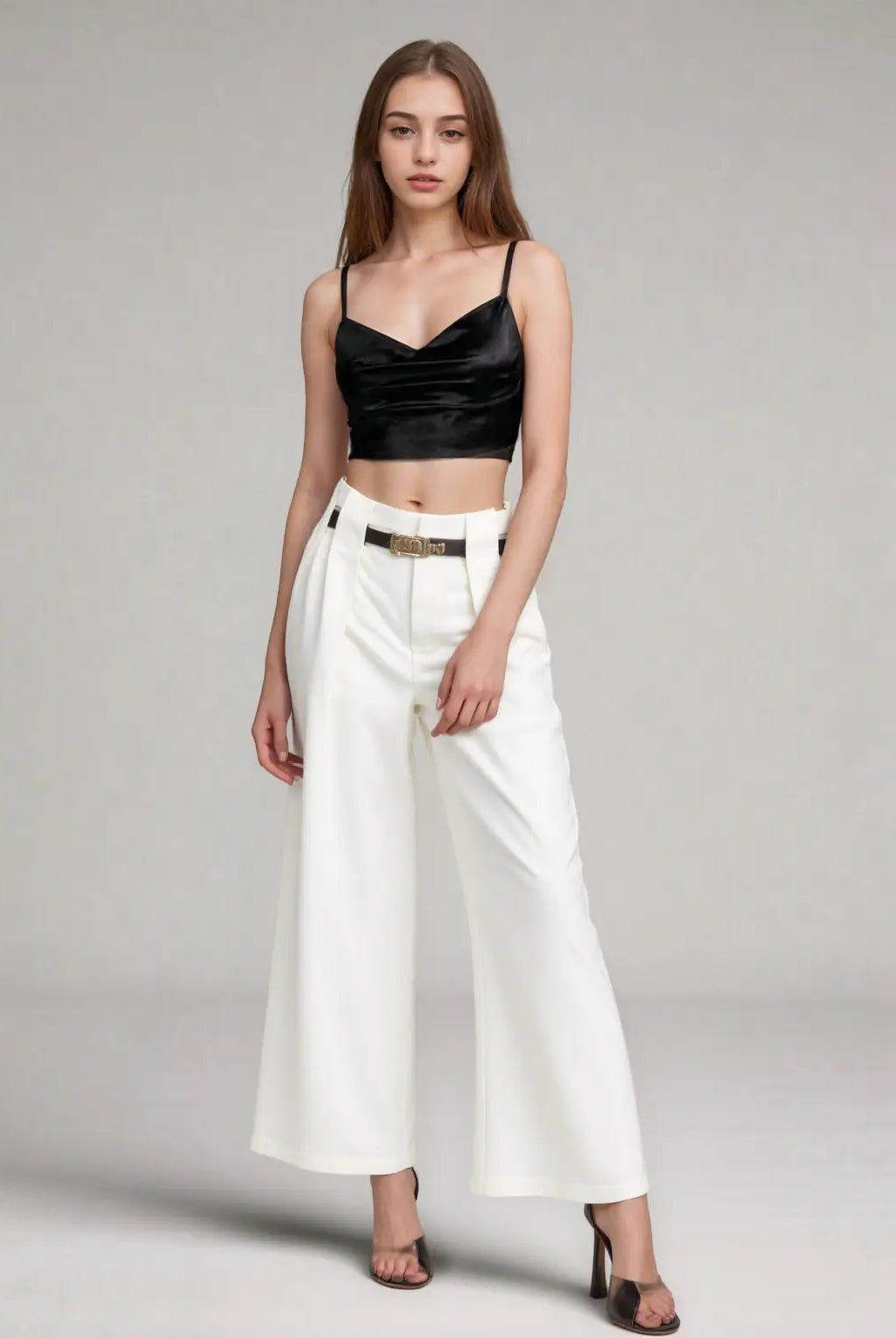 white high-waisted wide leg pants with belt detail.
